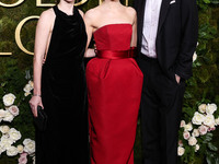 Ali Hertig, Emma Stone and Dave McCary arrive at the 82nd Annual Golden Globe Awards held at The Beverly Hilton Hotel on January 5, 2025 in...