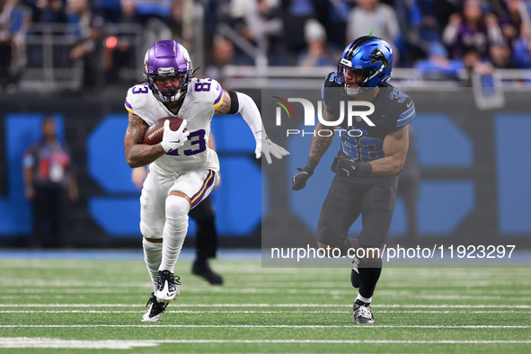 DETROIT,MICHIGAN-JANUARY 5:  Wide receiver Jalen Nailor (83) of the Minnesota Vikings runs the ball under the pressure of safety Brian Branc...