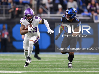 DETROIT,MICHIGAN-JANUARY 5:  Wide receiver Jalen Nailor (83) of the Minnesota Vikings runs the ball under the pressure of safety Brian Branc...