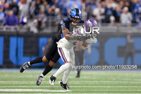 DETROIT,MICHIGAN-JANUARY 5:  Wide receiver Jalen Nailor (83) of the Minnesota Vikings is tackled by safety Brian Branch (32) of the Detroit...