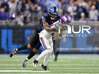 DETROIT,MICHIGAN-JANUARY 5:  Wide receiver Jalen Nailor (83) of the Minnesota Vikings is tackled by safety Brian Branch (32) of the Detroit...