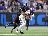 DETROIT,MICHIGAN-JANUARY 5:  Wide receiver Jalen Nailor (83) of the Minnesota Vikings is tackled by safety Brian Branch (32) of the Detroit...