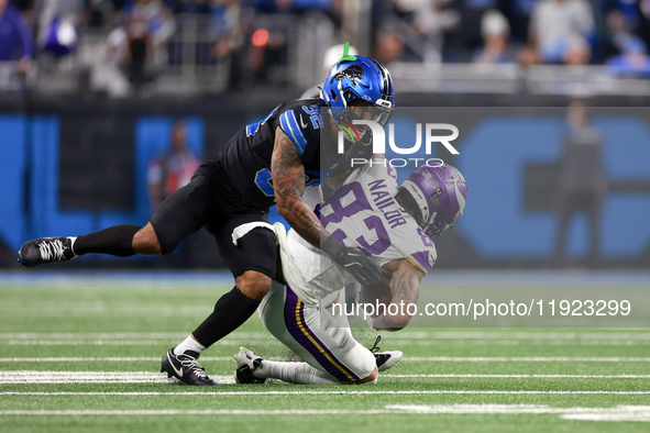 DETROIT,MICHIGAN-JANUARY 5:  Wide receiver Jalen Nailor (83) of the Minnesota Vikings is tackled by safety Brian Branch (32) of the Detroit...