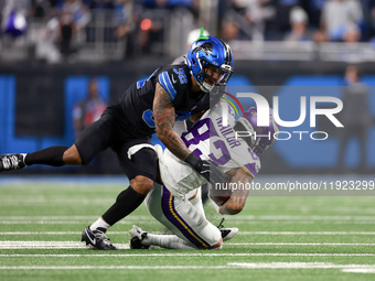 DETROIT,MICHIGAN-JANUARY 5:  Wide receiver Jalen Nailor (83) of the Minnesota Vikings is tackled by safety Brian Branch (32) of the Detroit...