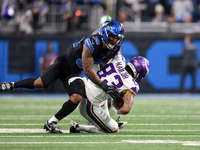 DETROIT,MICHIGAN-JANUARY 5:  Wide receiver Jalen Nailor (83) of the Minnesota Vikings is tackled by safety Brian Branch (32) of the Detroit...