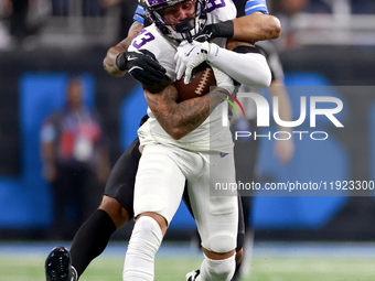 DETROIT,MICHIGAN-JANUARY 5:  Wide receiver Jalen Nailor (83) of the Minnesota Vikings runs the ball under the pressure of safety Brian Branc...