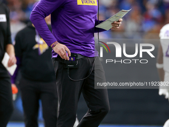 DETROIT,MICHIGAN-JANUARY 5:  Minnesota Vikings head coach Kevin O'Connell walks on the sidelines during a game between the Detroit Lions and...