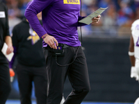 DETROIT,MICHIGAN-JANUARY 5:  Minnesota Vikings head coach Kevin O'Connell walks on the sidelines during a game between the Detroit Lions and...