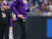 DETROIT,MICHIGAN-JANUARY 5:  Minnesota Vikings head coach Kevin O'Connell walks on the sidelines during a game between the Detroit Lions and...