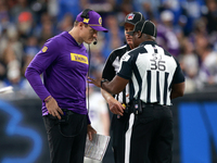 DETROIT,MICHIGAN-JANUARY 5:  Minnesota Vikings head coach Kevin O'Connell talks with officials on the sidelines during a game between the De...