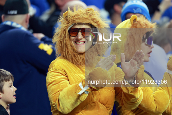 DETROIT,MICHIGAN-JANUARY 5:  A fan in a Lions costume cheers during a game between the Detroit Lions and the Minnesota Vikings in Detroit, M...