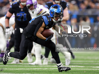 DETROIT,MICHIGAN-JANUARY 5:  Wide receiver Amon-Ra St. Brown (14) of the Detroit Lions carries the ball during a game between the Detroit Li...