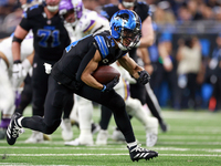 DETROIT,MICHIGAN-JANUARY 5:  Wide receiver Amon-Ra St. Brown (14) of the Detroit Lions carries the ball during a game between the Detroit Li...