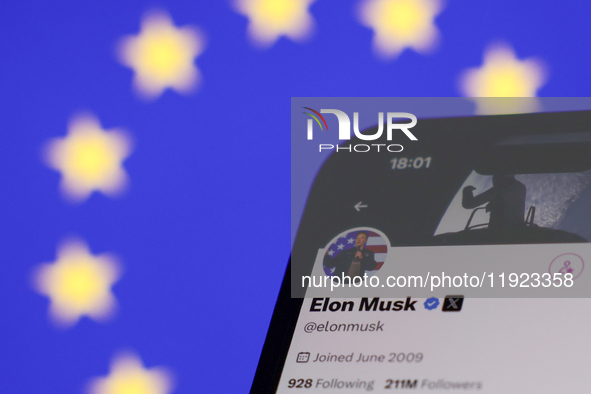 European Union flag displayed on a laptop screen and Elon Musk account on X displayed on a phone screen are seen in this illustration photo...