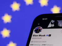 European Union flag displayed on a laptop screen and Elon Musk account on X displayed on a phone screen are seen in this illustration photo...