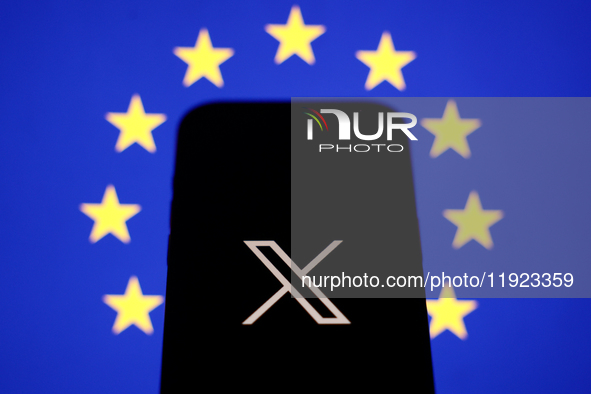 European Union flag displayed on a laptop screen and X logo displayed on a phone screen are seen in this illustration photo taken in Krakow,...