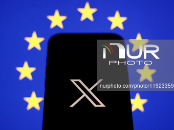 European Union flag displayed on a laptop screen and X logo displayed on a phone screen are seen in this illustration photo taken in Krakow,...