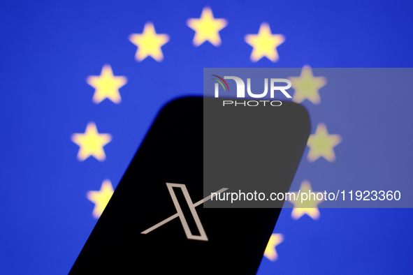 European Union flag displayed on a laptop screen and X logo displayed on a phone screen are seen in this illustration photo taken in Krakow,...