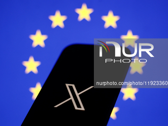 European Union flag displayed on a laptop screen and X logo displayed on a phone screen are seen in this illustration photo taken in Krakow,...