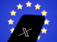 European Union flag displayed on a laptop screen and X logo displayed on a phone screen are seen in this illustration photo taken in Krakow,...