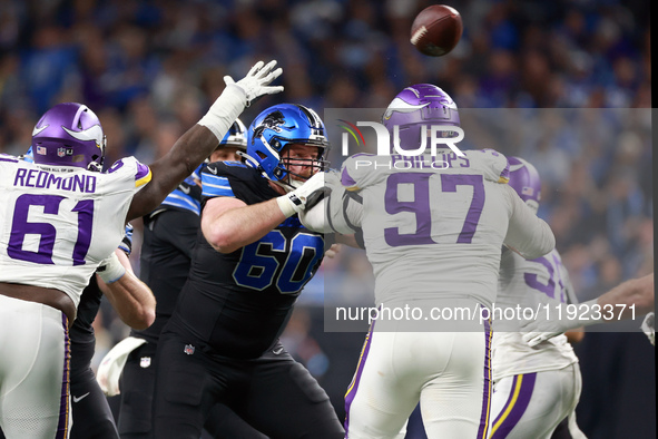 DETROIT,MICHIGAN-JANUARY 5:  Guard Graham Glasgow (60) of the Detroit Lions defends against defensive tackle Harrison Phillips (97) of the M...