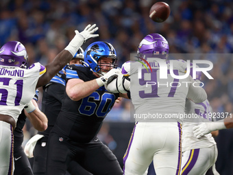 DETROIT,MICHIGAN-JANUARY 5:  Guard Graham Glasgow (60) of the Detroit Lions defends against defensive tackle Harrison Phillips (97) of the M...