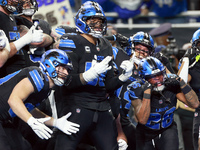 DETROIT,MICHIGAN-JANUARY 5:  Detroit Lions teammates celebrate a touchdown with running back Jahmyr Gibbs (26) of the Detroit Lions during a...