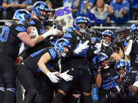 DETROIT,MICHIGAN-JANUARY 5:  Detroit Lions teammates celebrate a touchdown with running back Jahmyr Gibbs (26) of the Detroit Lions during a...