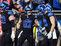 DETROIT,MICHIGAN-JANUARY 5:  Tight end Sam LaPorta (87) of the Detroit Lions reacgts to a touchdown during a game between the Detroit Lions...