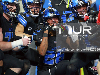 DETROIT,MICHIGAN-JANUARY 5:  Detroit Lions teammates celebrate a touchdown with running back Jahmyr Gibbs (26) of the Detroit Lions during a...