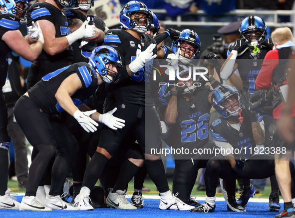 DETROIT,MICHIGAN-JANUARY 5:  Detroit Lions teammates celebrate a touchdown with running back Jahmyr Gibbs (26) of the Detroit Lions during a...