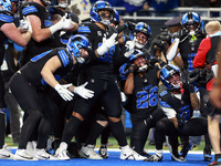 DETROIT,MICHIGAN-JANUARY 5:  Detroit Lions teammates celebrate a touchdown with running back Jahmyr Gibbs (26) of the Detroit Lions during a...