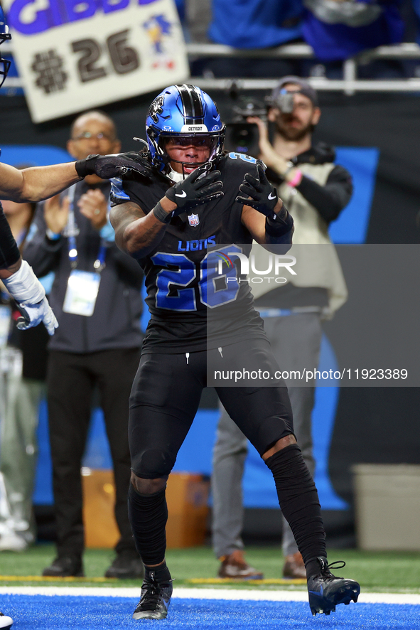 DETROIT,MICHIGAN-JANUARY 5:  Running back Jahmyr Gibbs (26) of the Detroit Lions celebrates a touchdown during a game between the Detroit Li...