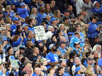 DETROIT,MICHIGAN-JANUARY 5:  Fans follow the paly  during a game between the Detroit Lions and the Minnesota Vikings in Detroit, Michigan US...