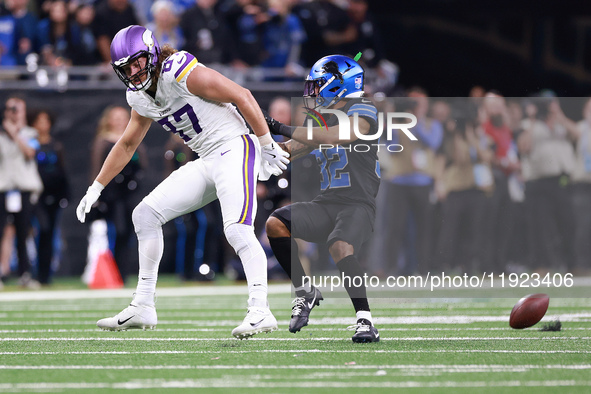 DETROIT,MICHIGAN-JANUARY 5:  Safety Brian Branch (32) of the Detroit Lions blocks tight end T.J. Hockenson (87) of the Minnesota Vikings fro...