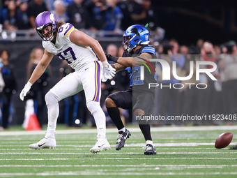 DETROIT,MICHIGAN-JANUARY 5:  Safety Brian Branch (32) of the Detroit Lions blocks tight end T.J. Hockenson (87) of the Minnesota Vikings fro...