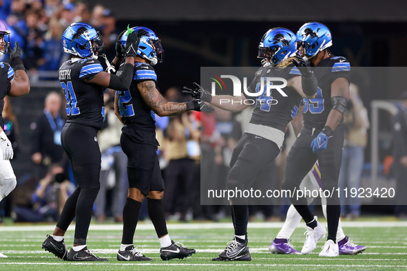 DETROIT,MICHIGAN-JANUARY 5:  Safety Kerby Joseph (31) of the Detroit Lions, safety Brian Branch (32) of the Detroit Lions and linebacker Ale...