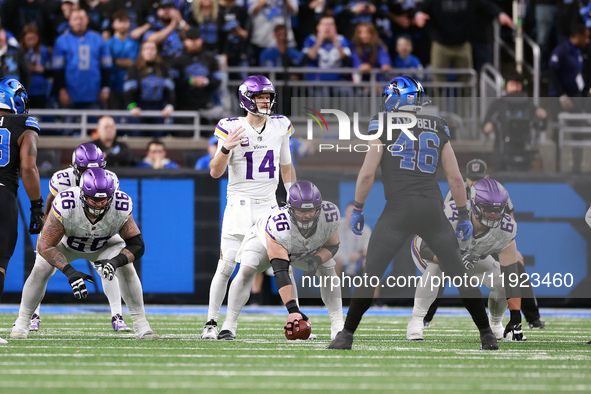 DETROIT,MICHIGAN-JANUARY 5:  Quarterback Sam Darnold (14) of the Minnesota Vikings calls a play during a game between the Detroit Lions and...