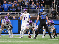 DETROIT,MICHIGAN-JANUARY 5:  Quarterback Sam Darnold (14) of the Minnesota Vikings calls a play during a game between the Detroit Lions and...