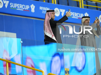 Spectators takes photos prior the EA SPORTS FC SUPERCUP 24/25 final match between FC Internazionale and AC Milan at Kingdom Arena on January...