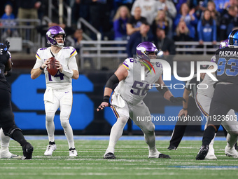 DETROIT,MICHIGAN-JANUARY 5:  Quarterback Sam Darnold (14) of the Minnesota Vikings looks to pass the ball during a game between the Detroit...