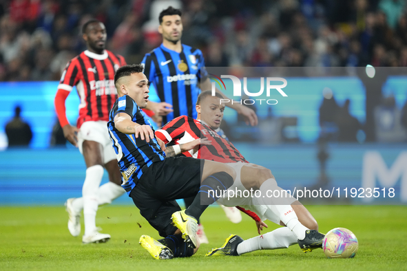 Malick Thiaw centre-back of AC Milan and Germany and Lautaro Martinez centre-forward of Internazionale and Argentina compete for the ball du...