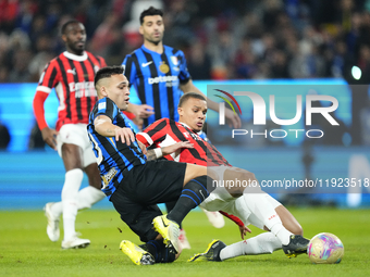 Malick Thiaw centre-back of AC Milan and Germany and Lautaro Martinez centre-forward of Internazionale and Argentina compete for the ball du...