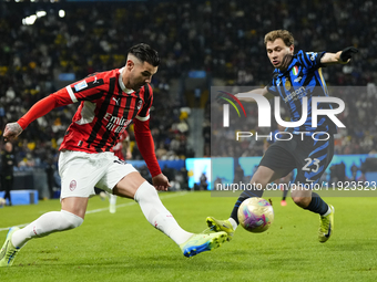 Theo Hernandez left-back of AC Milan and France and Nicolo Barella central midfield of Internazionale and Italy compete for the ball during...