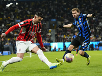 Theo Hernandez left-back of AC Milan and France and Nicolo Barella central midfield of Internazionale and Italy compete for the ball during...