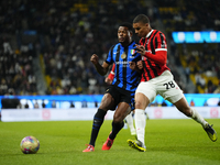 Denzel Dumfries right-back of Internazionale and Netherlands and Malick Thiaw centre-back of AC Milan and Germany compete for the ball durin...