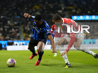 Denzel Dumfries right-back of Internazionale and Netherlands and Malick Thiaw centre-back of AC Milan and Germany compete for the ball durin...