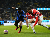 Denzel Dumfries right-back of Internazionale and Netherlands and Malick Thiaw centre-back of AC Milan and Germany compete for the ball durin...