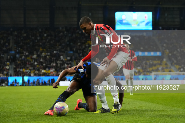 Denzel Dumfries right-back of Internazionale and Netherlands and Malick Thiaw centre-back of AC Milan and Germany compete for the ball durin...