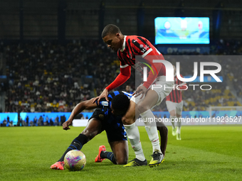 Denzel Dumfries right-back of Internazionale and Netherlands and Malick Thiaw centre-back of AC Milan and Germany compete for the ball durin...